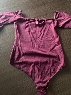 Skims off shoulder bodysuit in plum purple